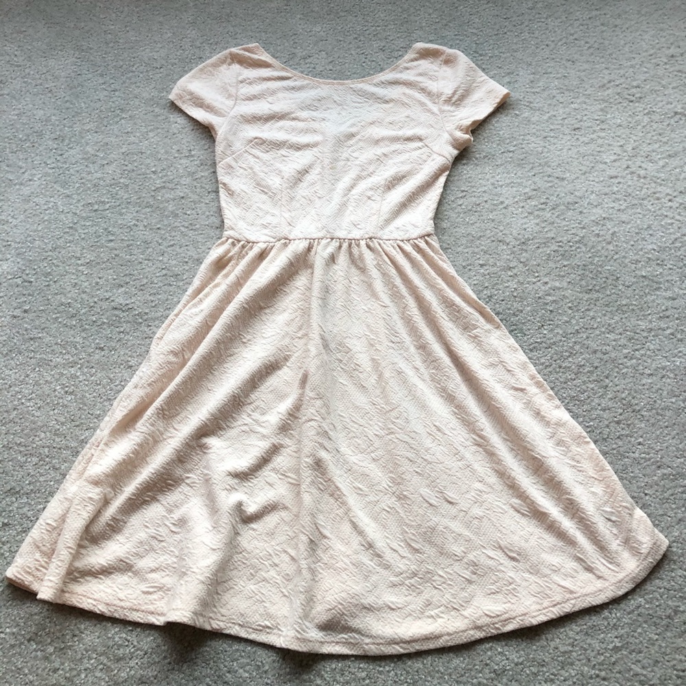 Lace pattern white dress.